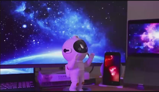Astronaut galaxy projector light creating starry night ceiling with remote control